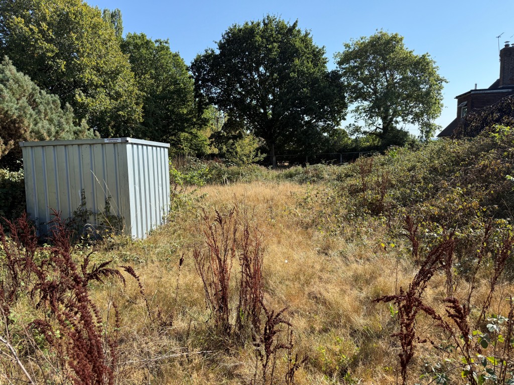 Lot: 17 - BUILDING PLOT IN SOUGHT AFTER EAST SUSSEX VILLAGE - Image showing land and storage container